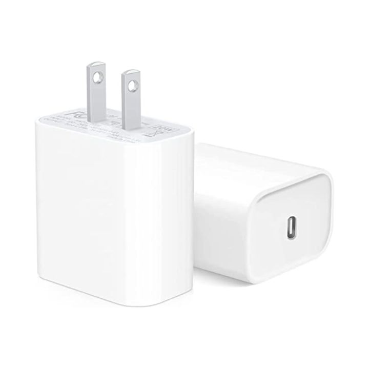 White power adapter with USB-C cable on a white background. Front angled view of the original Apple 20W USB-C power adapter with a 2-pin plug design, featuring a compact white glossy unibody casing on a clean background.
