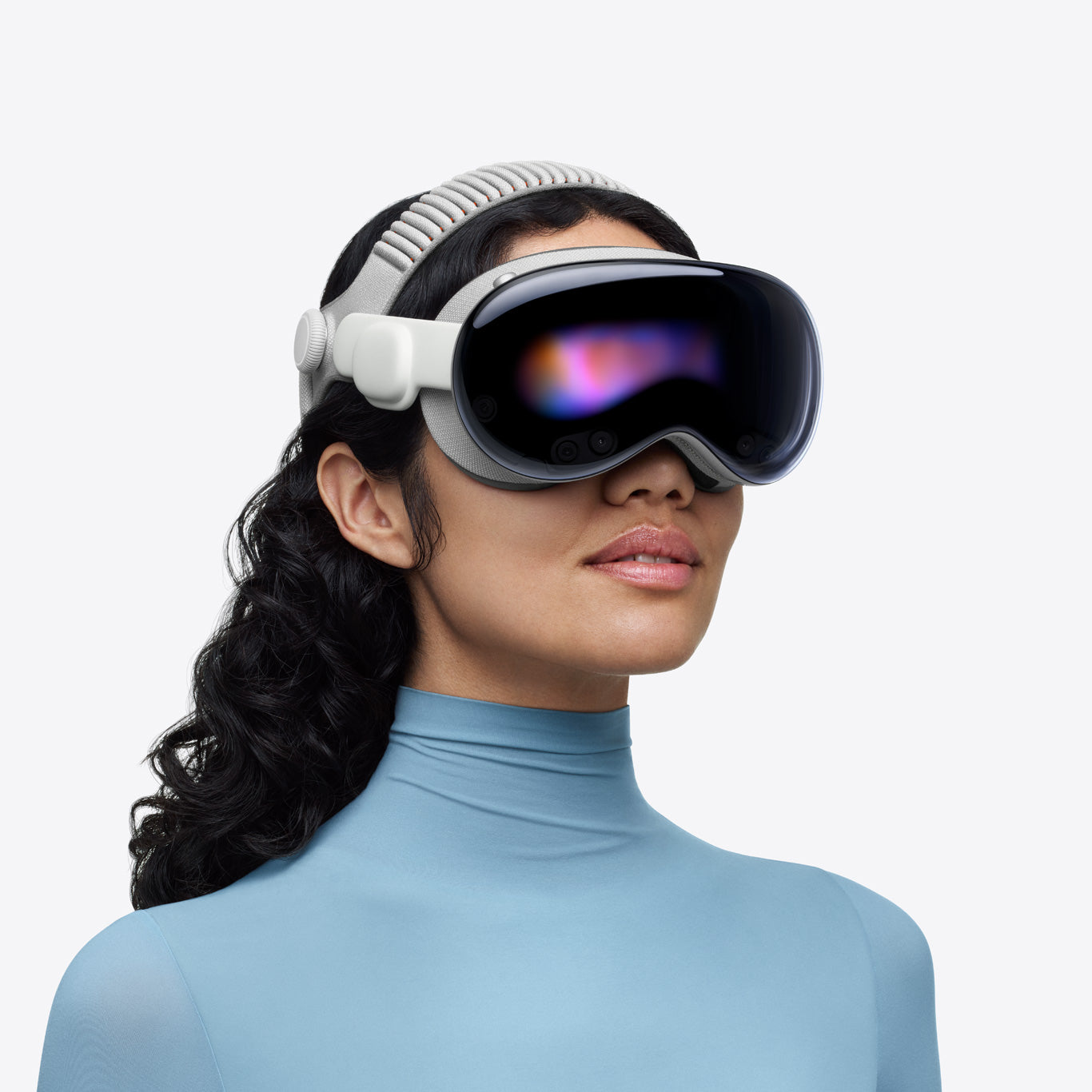 A person wearing Apple Vision Pro spatial computer headset against a clean white background.